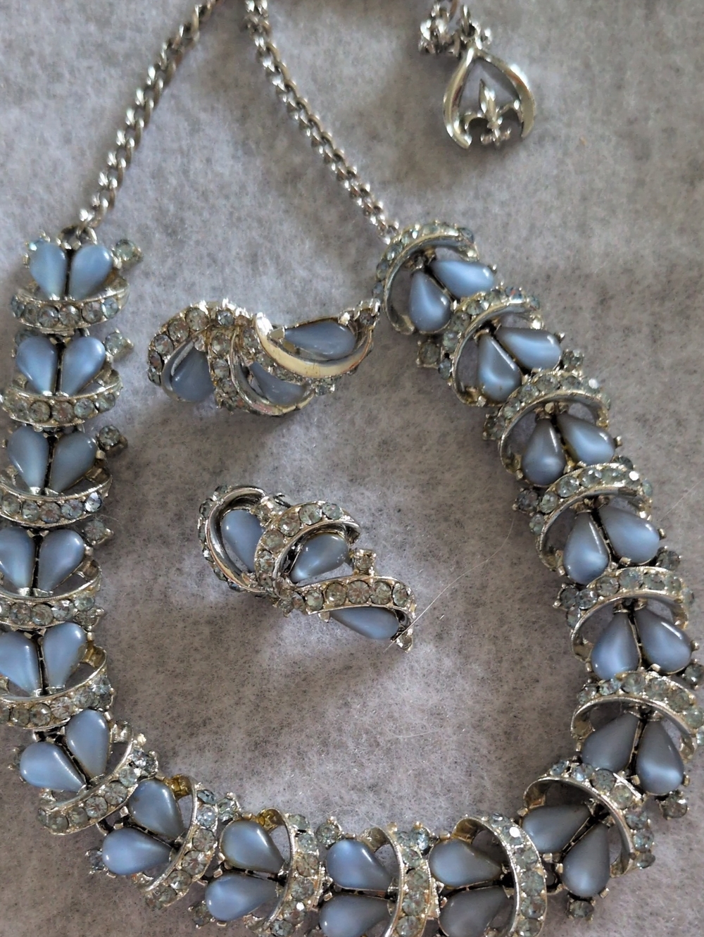 Elegant Silver Necklace and Earring Set with Light Blue Accents. Rousseau Brand